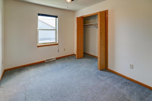555 Kelvington Dr Unit 4, Sun Prairie, WI 53590 - unfurnished bedroom featuring carpet, baseboards, and a closet