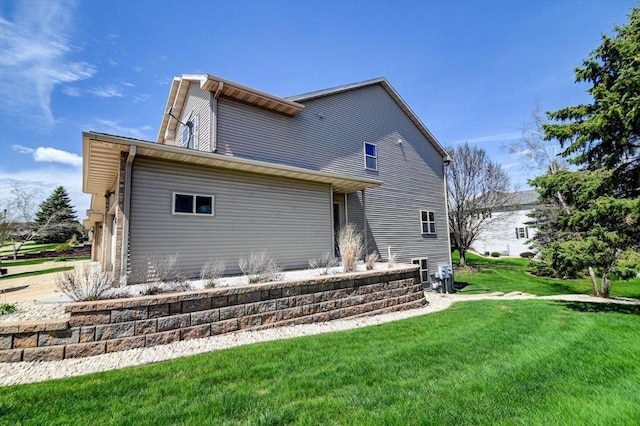 555 Kelvington Dr Unit 4, Sun Prairie, WI 53590 - back of house featuring a yard