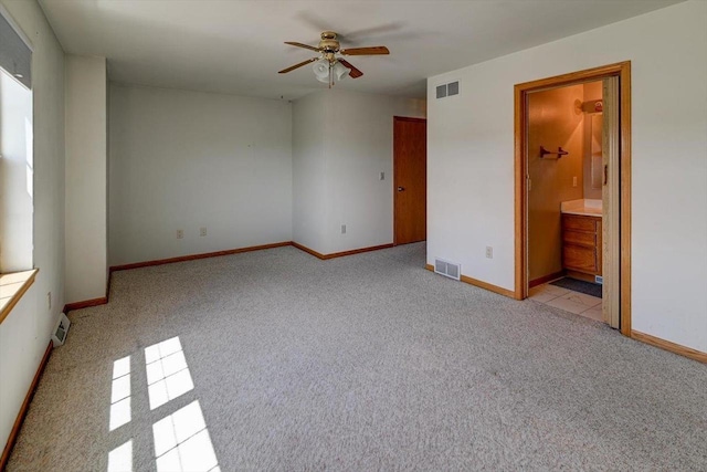 555 Kelvington Dr Unit 4, Sun Prairie, WI 53590 - unfurnished bedroom with light carpet, baseboards, and ensuite bathroom
