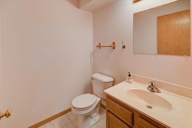 555 Kelvington Dr Unit 4, Sun Prairie, WI 53590 - half bathroom with toilet, vanity, baseboards, and marble look tiles
