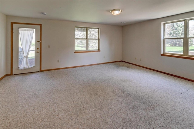 555 Kelvington Dr Unit 4, Sun Prairie, WI 53590 - carpeted empty room featuring baseboards