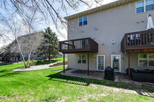 555 Kelvington Dr Unit 4, Sun Prairie, WI 53590 - rear view of property featuring a yard, a deck, and a patio