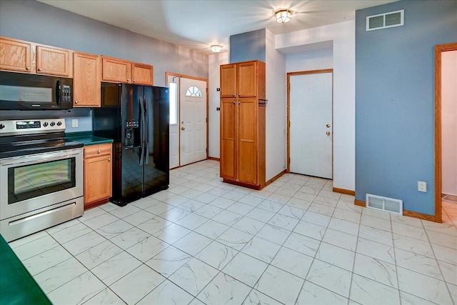555 Kelvington Dr Unit 4, Sun Prairie, WI 53590 - kitchen featuring black appliances, light marble finish flooring, baseboards, and dark countertops