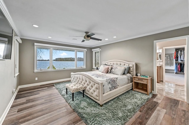 bedroom featuring crown molding, recessed lighting, and wood finished floors