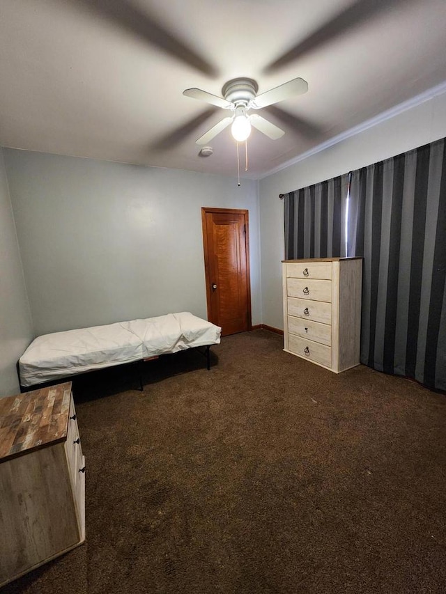 bedroom with dark carpet and ceiling fan