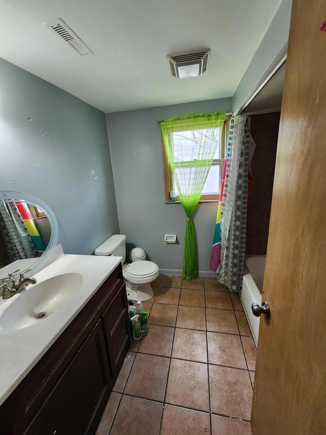 full bathroom featuring toilet, visible vents, tile patterned flooring, and vanity