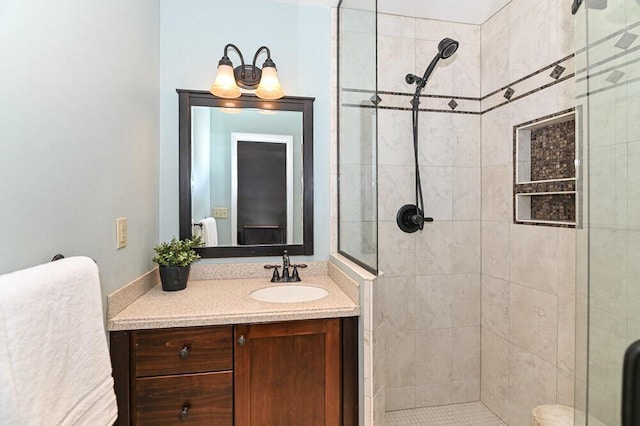 bathroom with vanity and a stall shower
