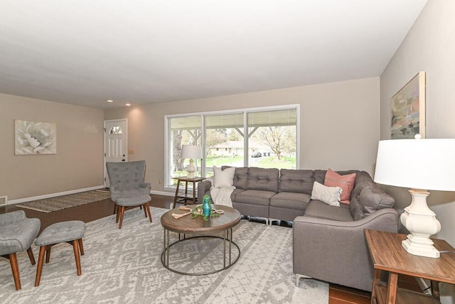 living room with recessed lighting and baseboards