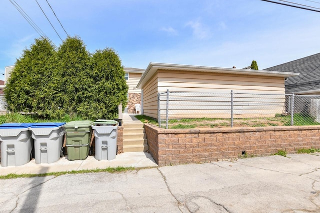 view of property exterior featuring fence