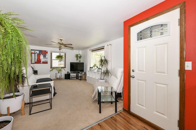 entryway with a ceiling fan and wood finished floors