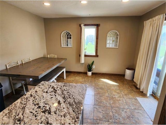 dining room featuring recessed lighting and baseboards