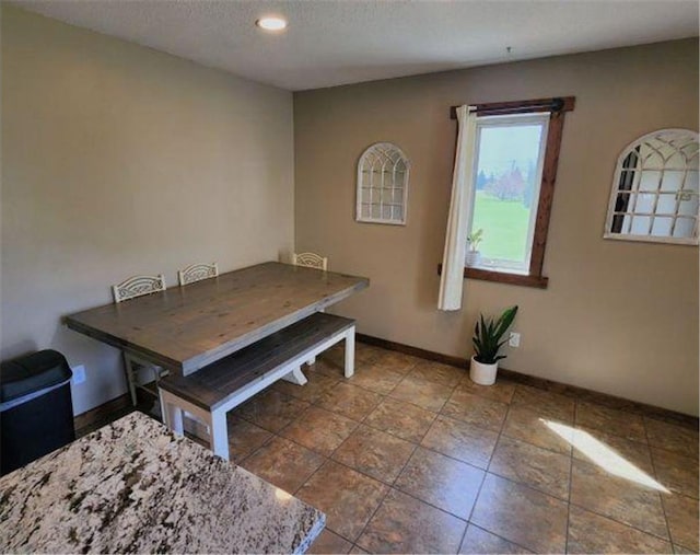 dining room with baseboards and recessed lighting