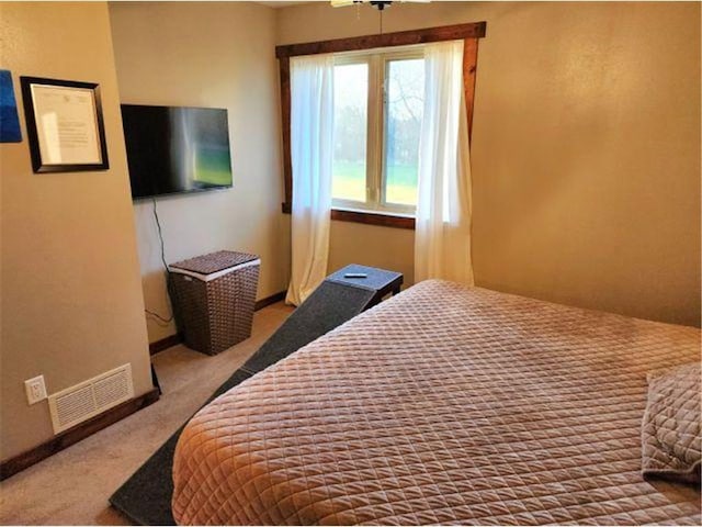 bedroom featuring visible vents and carpet flooring