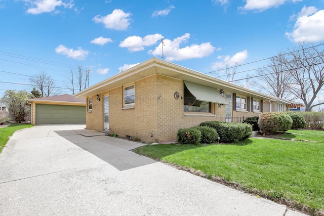 view of property exterior featuring brick siding, an outdoor structure, a lawn, and a garage