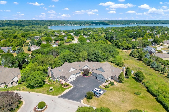 birds eye view of property featuring a water view and a residential view