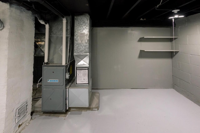 utility room with heating unit