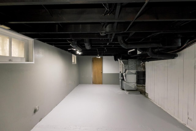 finished basement featuring heating unit