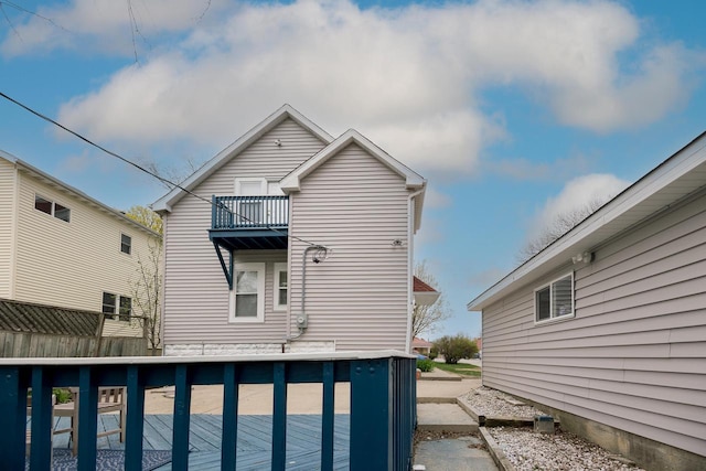 rear view of property with a balcony