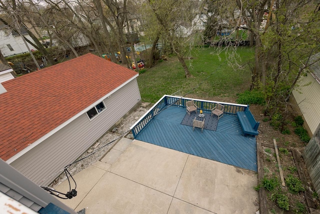 view of pool with a lawn and a wooden deck