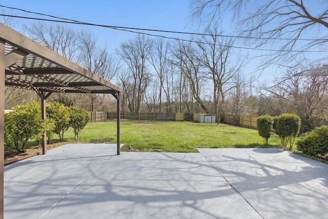 view of yard featuring a pergola, a patio, a shed, a fenced backyard, and an outdoor structure