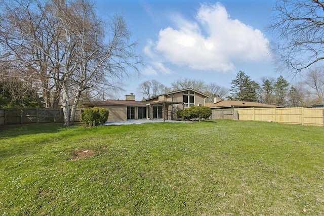 view of yard featuring a patio and a fenced backyard