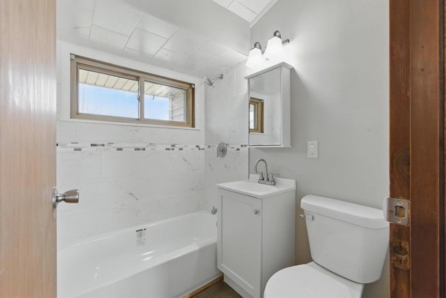 full bathroom with vanity, toilet, and  shower combination