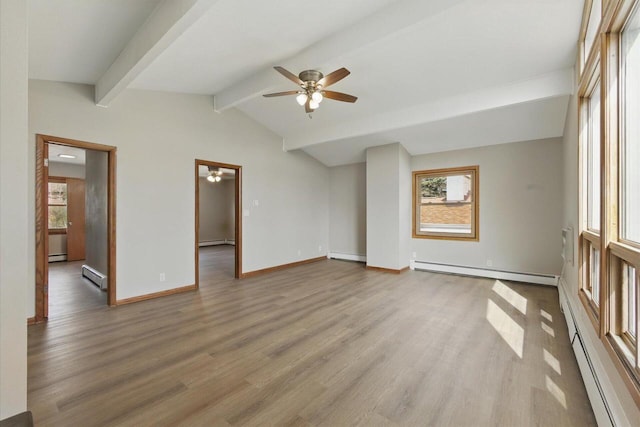 interior space featuring baseboard heating, a ceiling fan, and wood finished floors