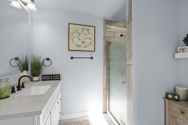 full bathroom with a shower stall and vanity