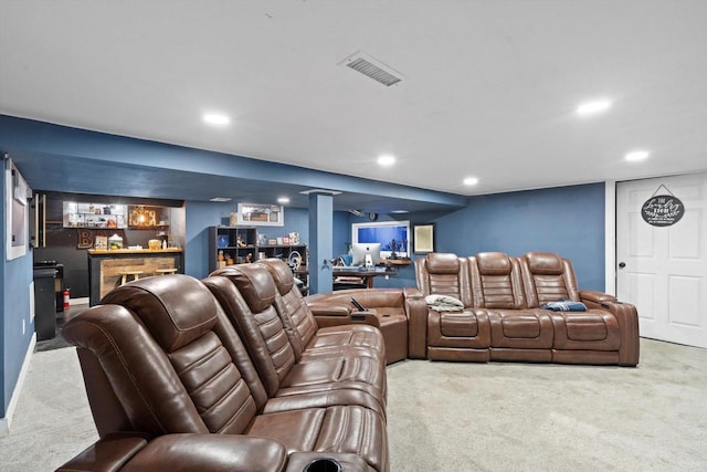 home theater with recessed lighting, a bar, and carpet