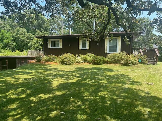 exterior space featuring a yard and a deck
