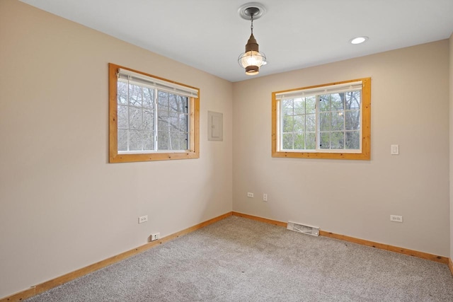 carpeted empty room featuring recessed lighting, baseboards, and visible vents