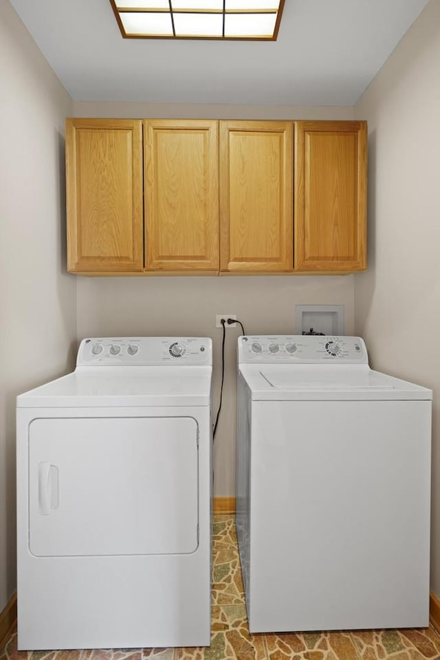 laundry room featuring cabinet space and independent washer and dryer