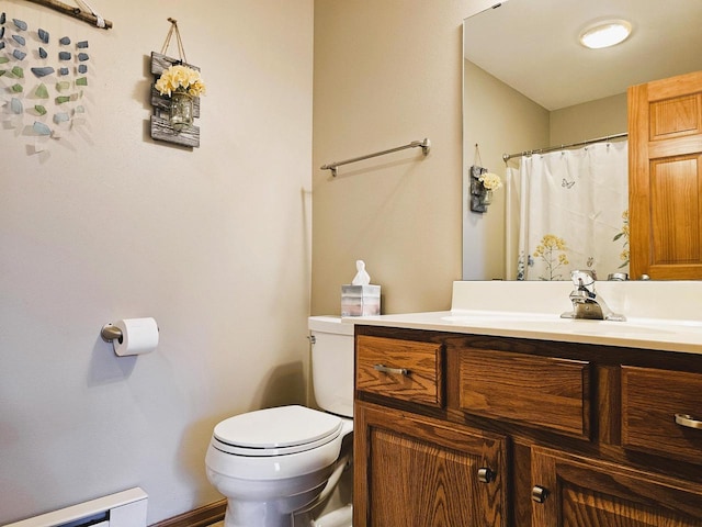 850 Evergreen Dr Unit 8, Hartford, WI 53027 - full bathroom with vanity, a baseboard heating unit, and toilet