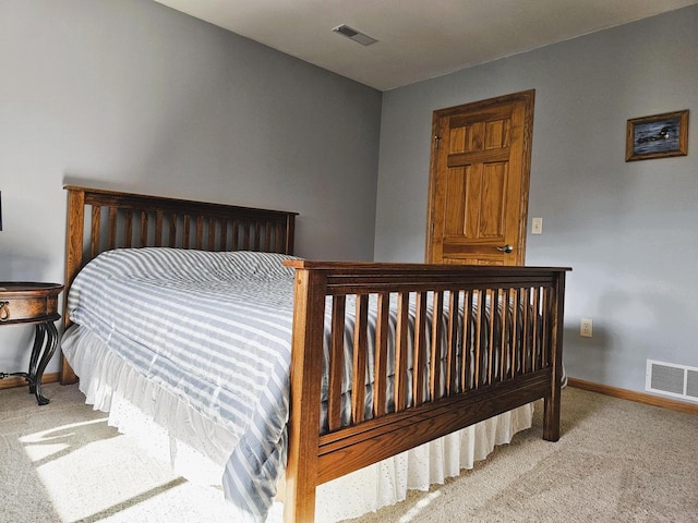 850 Evergreen Dr Unit 8, Hartford, WI 53027 - bedroom with baseboards, visible vents, and carpet