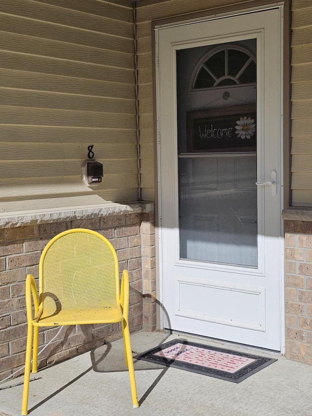 850 Evergreen Dr Unit 8, Hartford, WI 53027 - doorway to property featuring brick siding