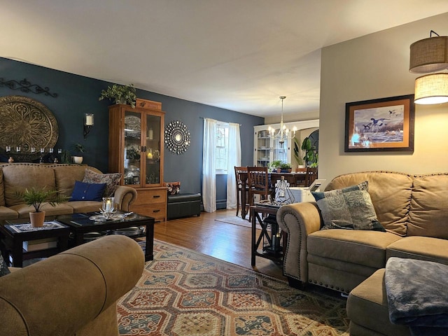 living room with an inviting chandelier and wood finished floors