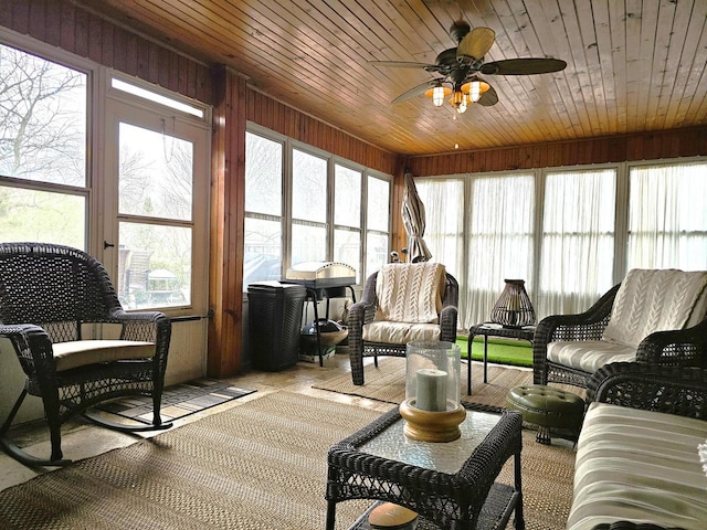 sunroom with wooden ceiling, plenty of natural light, and a ceiling fan