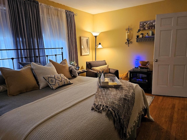 bedroom featuring wood finished floors