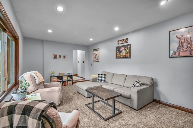 carpeted living room featuring recessed lighting and baseboards