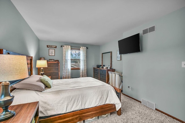 carpeted bedroom featuring visible vents and baseboards