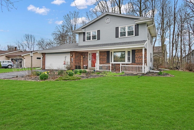 view of front of property featuring an attached garage, a front lawn, brick siding, a porch, and driveway