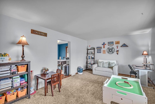 game room with baseboards and carpet flooring