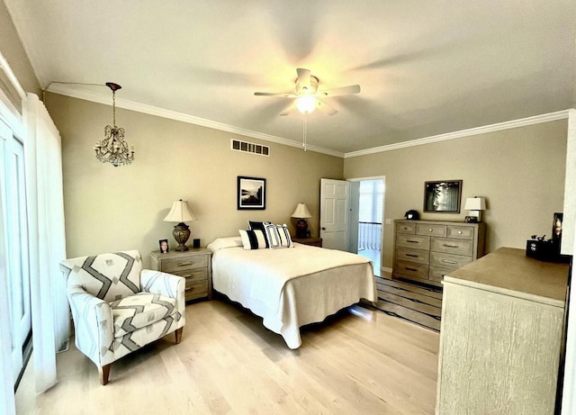bedroom with crown molding, a ceiling fan, light wood-style flooring, and visible vents