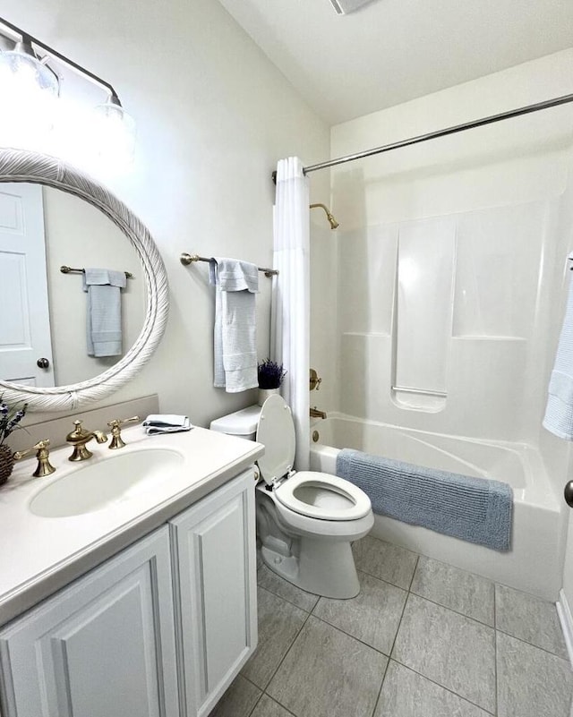 full bath featuring vanity, tile patterned flooring, toilet, and shower / bath combination with curtain
