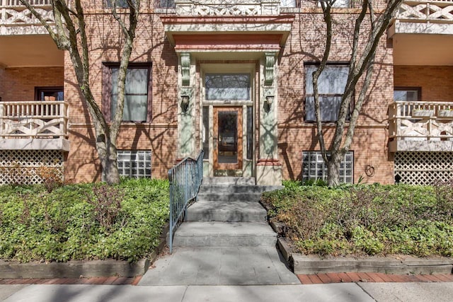 property entrance with brick siding