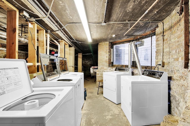 washroom with washer and dryer and laundry area