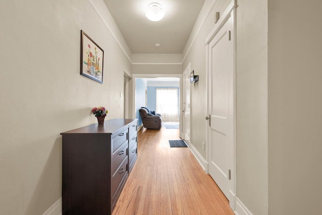 hallway featuring light wood-style flooring