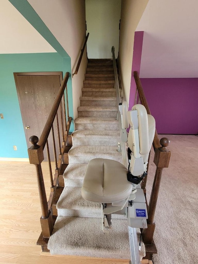 staircase featuring baseboards