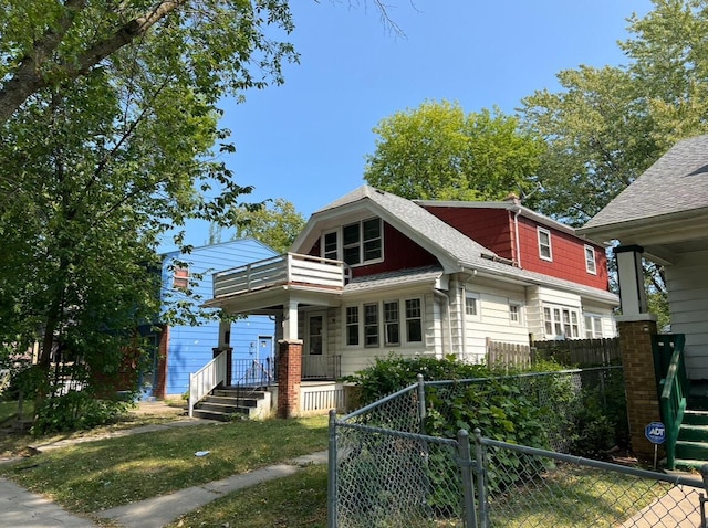 4566 N 28th St, Milwaukee, WI 53209 - bungalow with a gate, a fenced front yard, a balcony, and roof with shingles