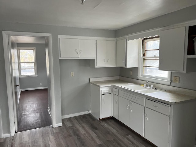 4566 N 28th St, Milwaukee, WI 53209 - kitchen with open shelves, a sink, light countertops, dark wood finished floors, and white cabinetry